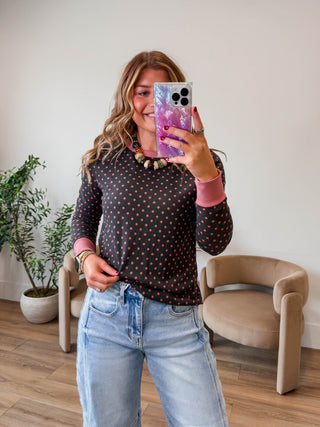 The Grace Polka Dot Top brings effortless style to your everyday wardrobe. Featuring a classic polka dot pattern, this top combines playful charm with all-day comfort. Crafted from soft, breathable fabric, it's designed to move with you throughout your day. Perfect for casual outings, work, or relaxed weekends, the Grace top pairs easily with jeans, skirts, or shorts for endless styling possibilities. A versatile essential that feels as good as it looks.