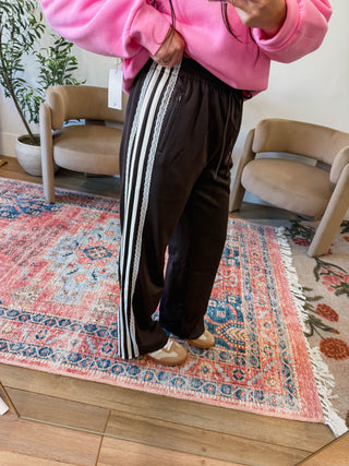 The Ella Track Pants bring effortless style from office to weekend. Crafted in a rich dark espresso brown with contrasting white stripe and delicate lace detailing along the sides, these pants transition seamlessly between casual and dressed-up looks. The relaxed fit and refined accents make them perfect for pairing with sneakers or heels, giving you versatility that works as hard as you do.
house of color Autumn
shop by color season