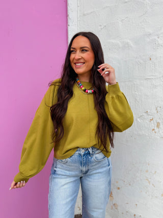Effortless elegance meets modern style with this solid long puff sleeve sweater. The round neckline and center seam detail at the front add sophisticated structure, while banded cuffs provide a polished finish. Crafted in a trendy green hue, this versatile top layers beautifully for any season and pairs seamlessly with your everyday wardrobe.
house of color Autumn
shop by color season