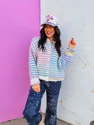 Wrap yourself in color with the Rainbow Rush Cardigan, a charming knit piece that transitions effortlessly from office to weekend. Featuring a playful rainbow design, this cardigan offers a comfortable, relaxed fit that layers beautifully over tees, dresses, and tops. Perfect for adding warmth and personality to any outfit, it's the versatile staple that brings joy to your everyday wardrobe.
house of color Summer
shop by color season