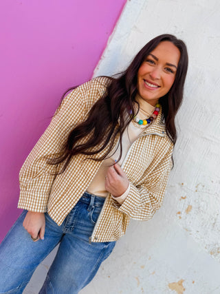 A lightweight gingham jacket featuring a structured high neckline, concealed front closure, and relaxed drop-shoulder silhouette. Designed with roomy side pockets, wide cuffs, and a softly gathered hem for an effortlessly modern shape. A standout layering piece for easy transitional styling.
house of color Autumn
house of color Spring
shop by color season