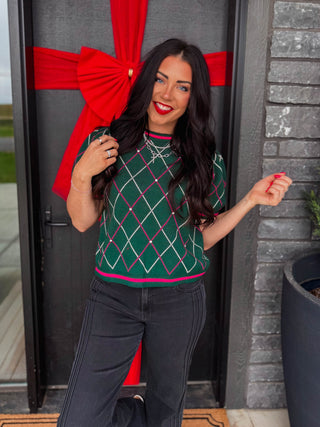 Elevate your holiday wardrobe with this charming Tinsel Time Knit Top. Featuring a classic argyle pattern and short puff sleeves, this knit top combines playful style with seasonal sparkle. The round neckline is adorned with rhinestone detailing that catches the light, while ribbed trim at the cuffs and hem ensures a polished fit. Perfect for festive gatherings, casual holiday outings, or cozy winter days, this piece brings warmth and whimsy to your seasonal rotation.
house of color Winter