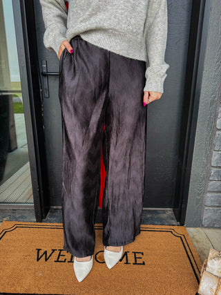 These pleated satin wide leg pants bring effortless glamour and fluid motion to evening dressing. Crafted with an comfortable elastic waistband and allover plissé pleating, they deliver an elongated silhouette with total ease. Pair them with a blouse top for a dramatic look or style with a cozy knit sweater for fall and winter. 
house of color Winter